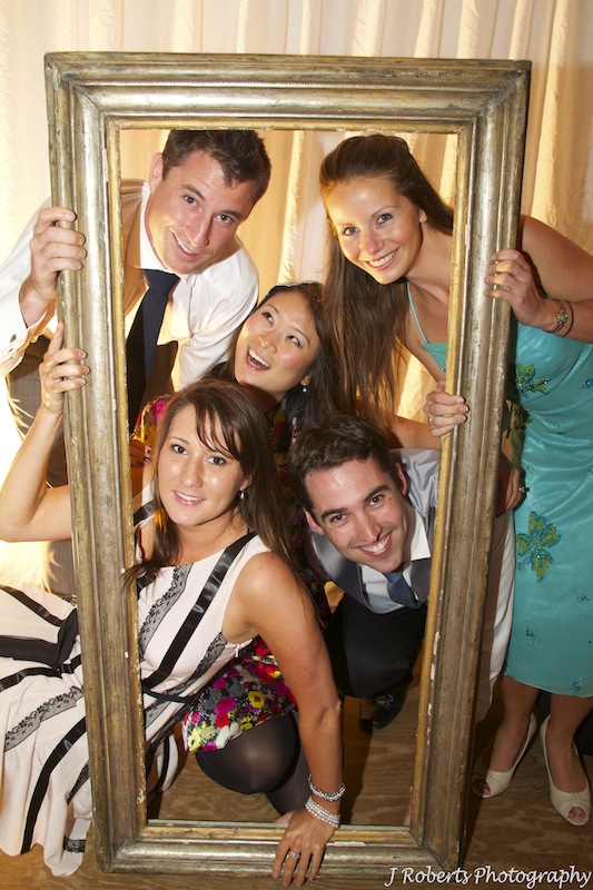Photo booth fun at wedding reception - wedding photography